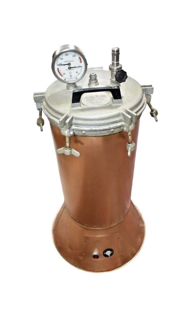 Copper pressure cooker with gauge and valve.