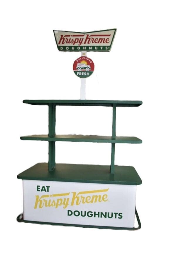 Krispy Kreme donut stand with shelves.