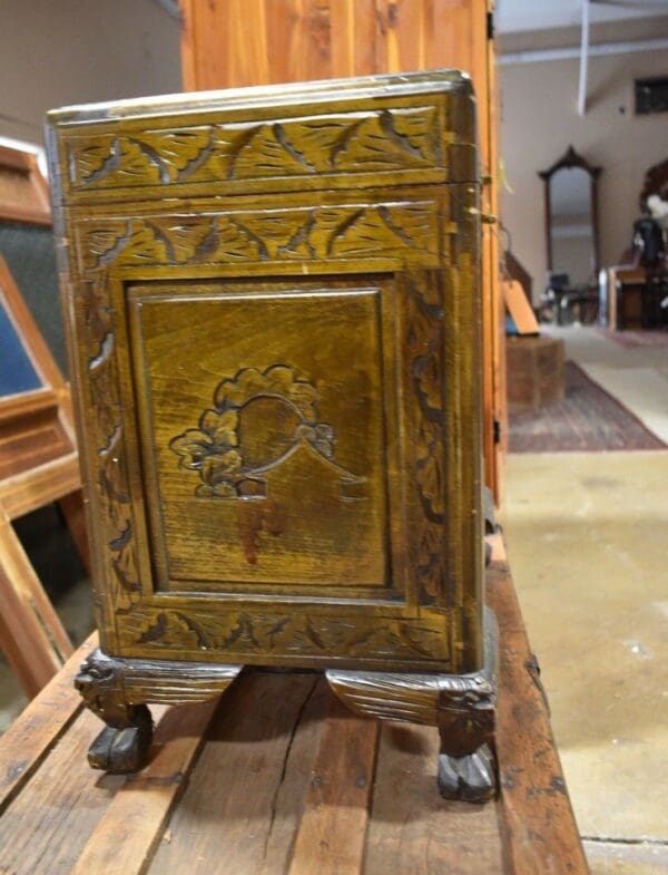 vintage Heavily carved asian inspired chest with claw feet