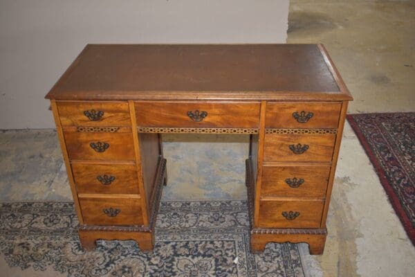 Antique Leather Top Kneehole Desk