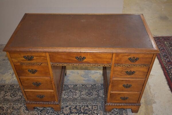 Antique Leather Top Kneehole Desk