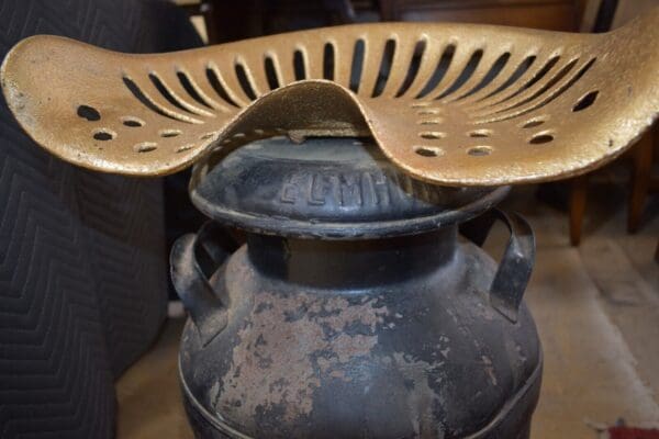 Antique Tractor Seat Chair on Vintage Metal Milk Can, Jamaica NY